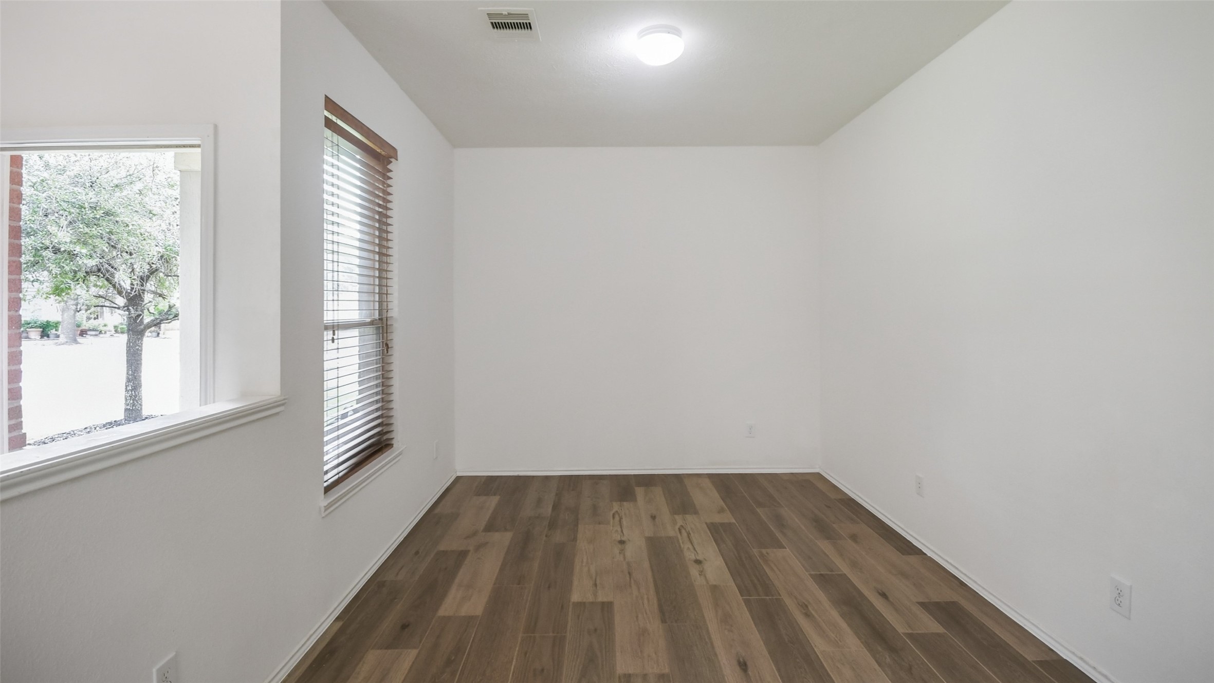 18206 West Ridge Bend Lane Cypress, TX 77433 - Photo 14 of 16 a view of empty room with wooden floor and fan