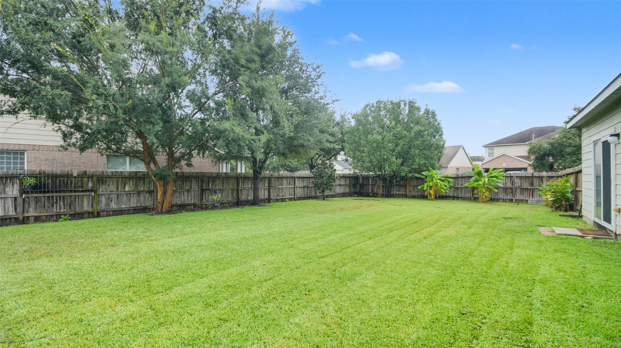 18206 West Ridge Bend Lane Cypress, TX 77433 - Photo 16 of 16 a view of a backyard with a garden