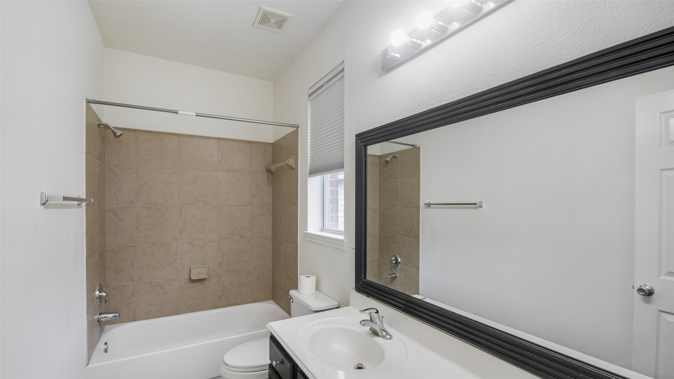 18206 West Ridge Bend Lane Cypress, TX 77433 - Photo 6 of 16 a bathroom with a sink and a bathtub