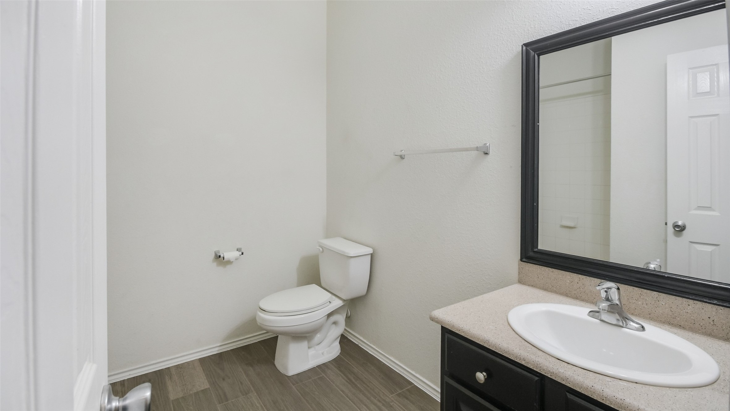 18206 West Ridge Bend Lane Cypress, TX 77433 - Photo 8 of 16 a bathroom with a sink toilet and a mirror