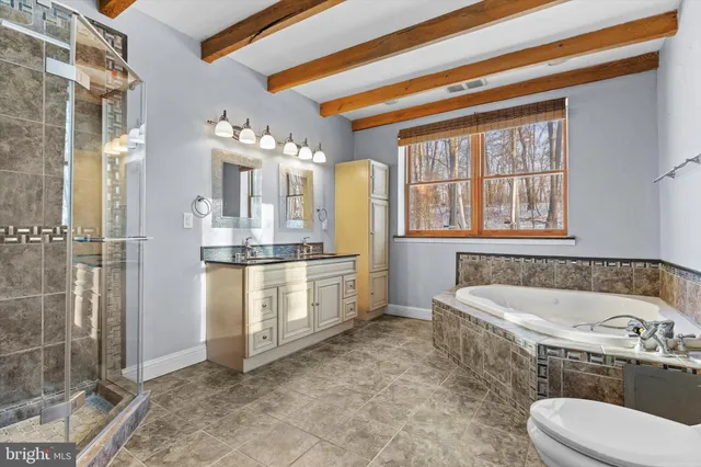 a bathroom with a sink a vanity and a mirror