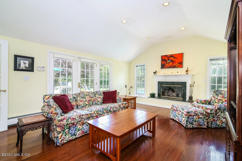 91 Winthrop Drive Riverside, CT 06878 - Photo 14 of 30 a living room with furniture large window and a fireplace