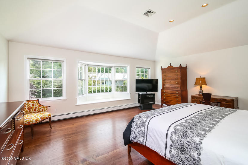 91 Winthrop Drive Riverside, CT 06878 - Photo 20 of 30 a bedroom with bed chair and window