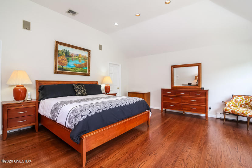 91 Winthrop Drive Riverside, CT 06878 - Photo 21 of 30 a bedroom with bed and wooden floor