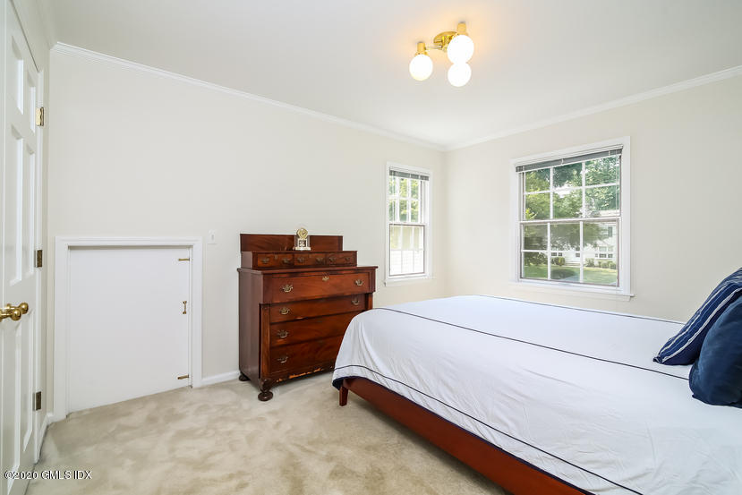 91 Winthrop Drive Riverside, CT 06878 - Photo 27 of 30 a bedroom with a bed and a window