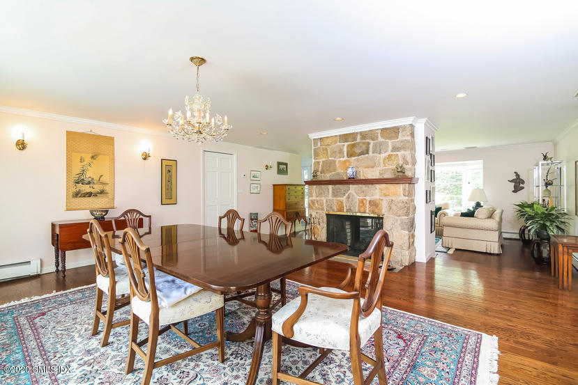 91 Winthrop Drive Riverside, CT 06878 - Photo 6 of 30 a dining room with furniture a chandelier and wooden floor
