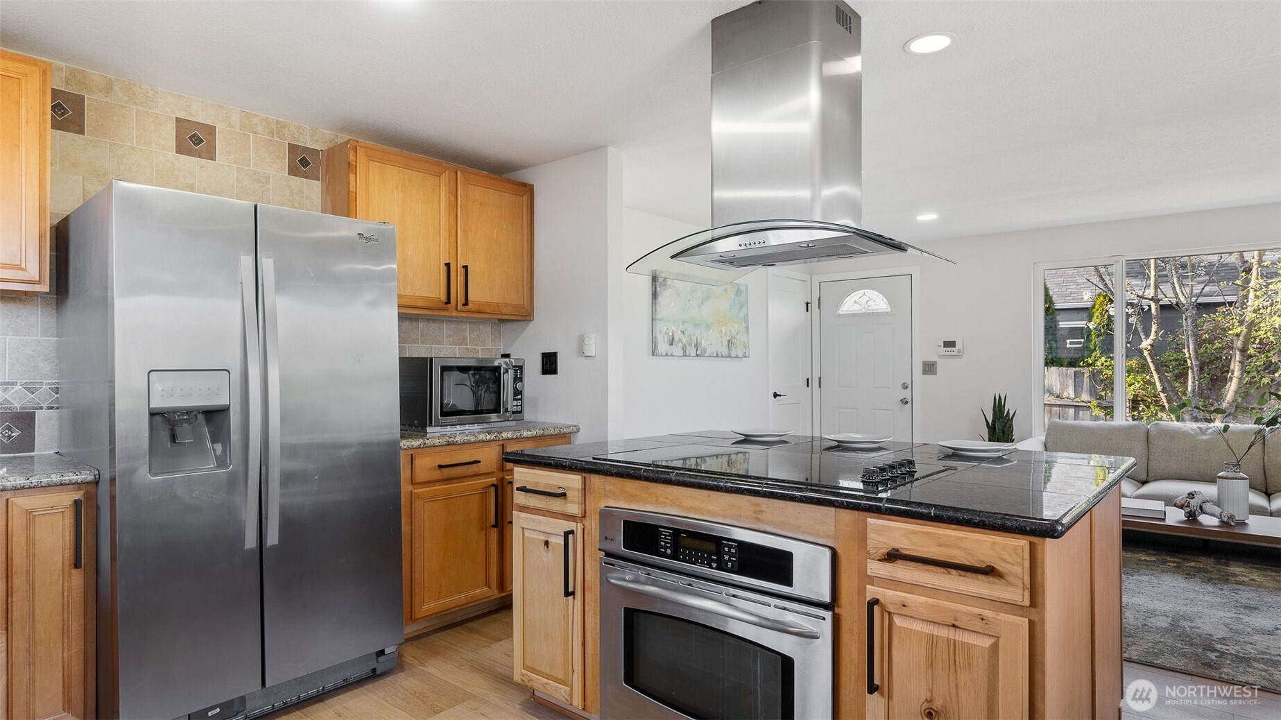 2520 Chestnut Street Everett, WA 98201 - Photo 11 of 29 a kitchen with granite countertop a refrigerator stove and cabinets