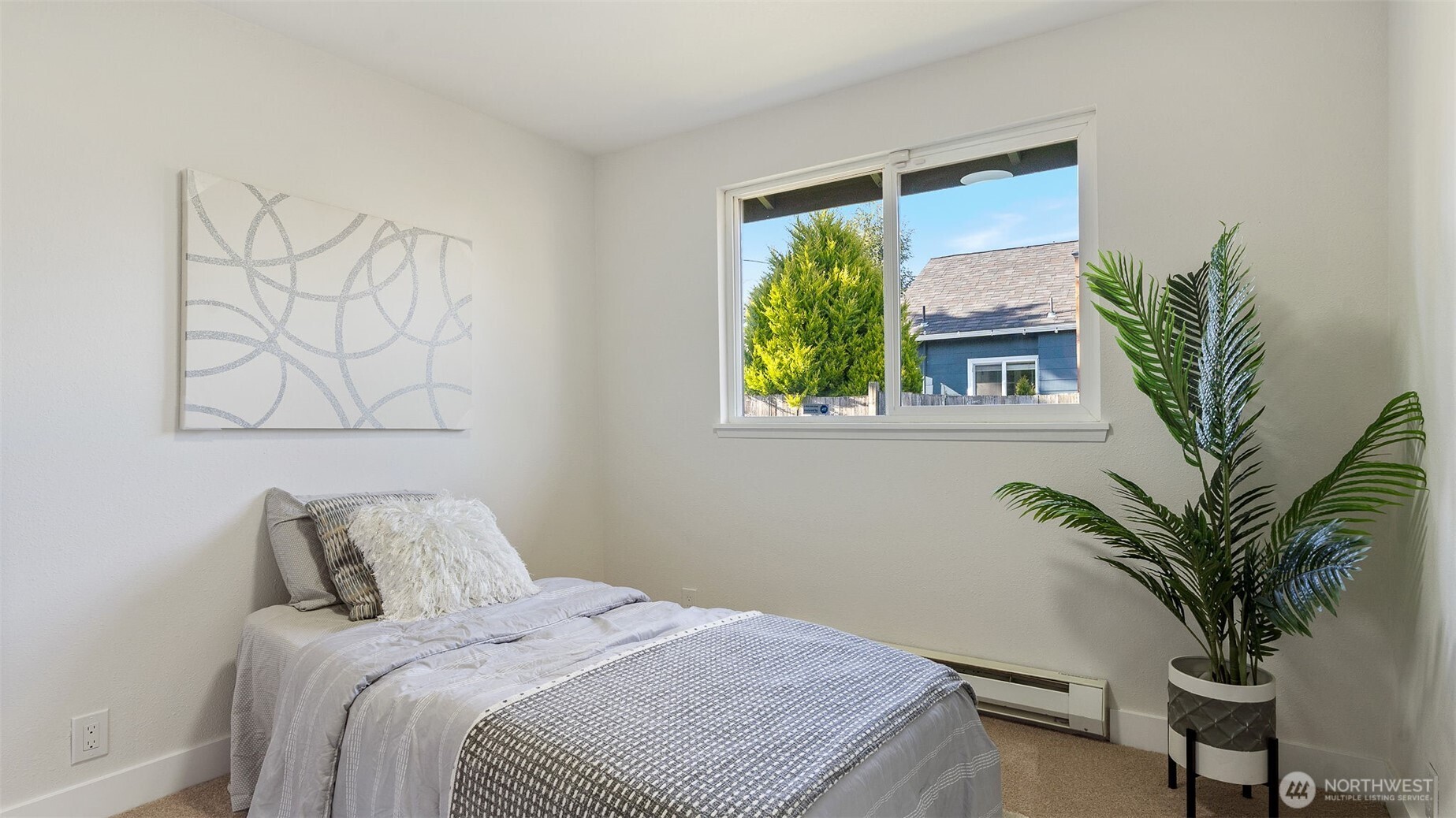 2520 Chestnut Street Everett, WA 98201 - Photo 13 of 29 a bedroom with a large bed and a potted plant