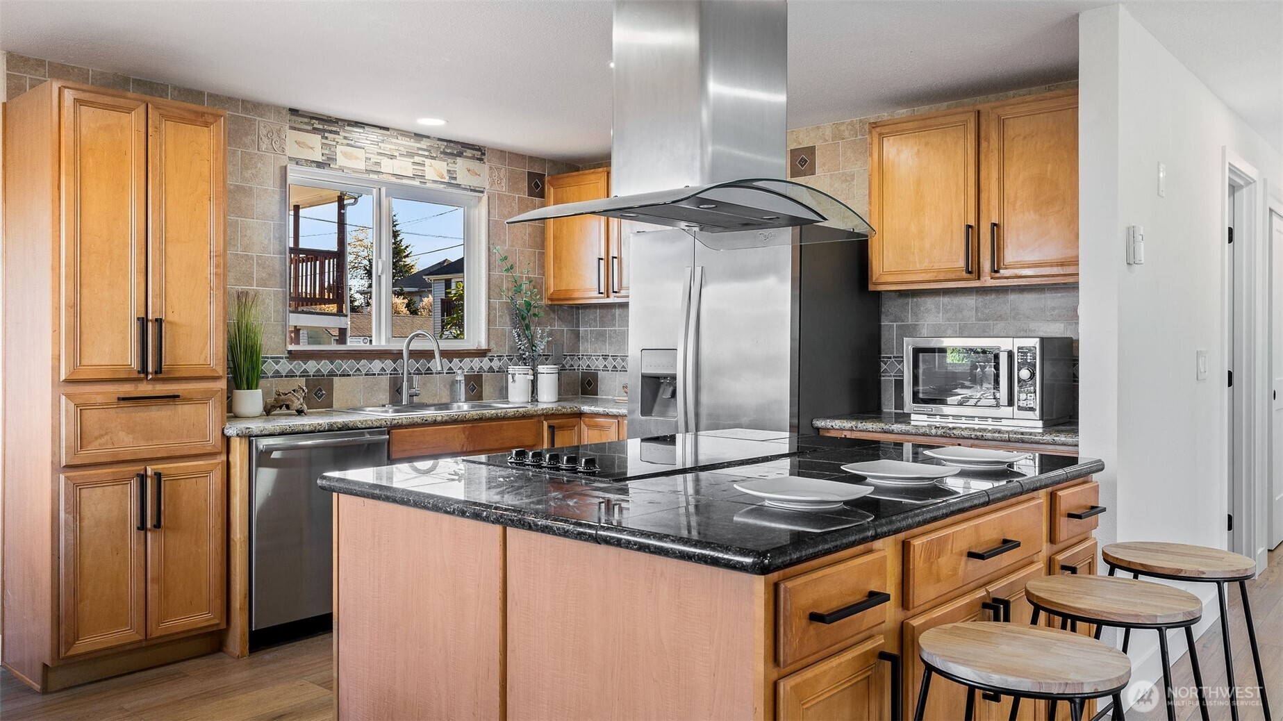 2520 Chestnut Street Everett, WA 98201 - Photo 9 of 29 a kitchen with stainless steel appliances granite countertop a stove refrigerator sink and cabinets
