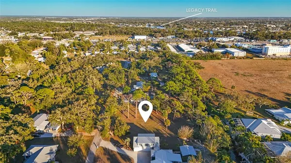 an aerial view of a houses with a city