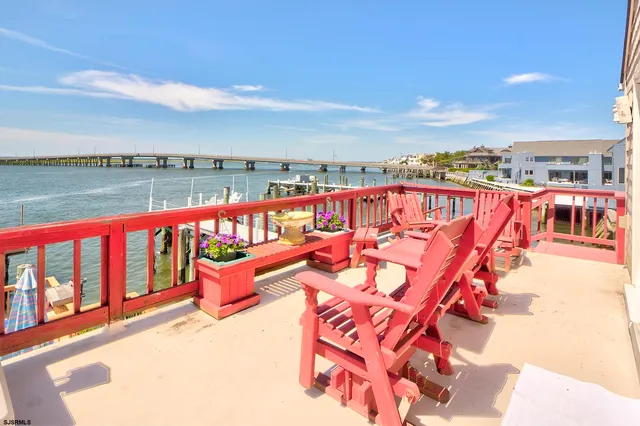 a balcony with an outdoor seating