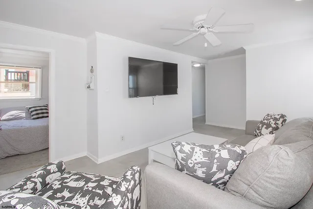 a bedroom with bed and a flat screen tv