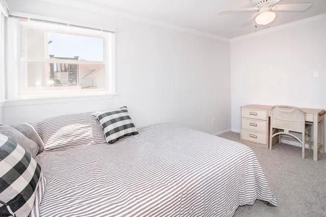 a bedroom with a bed and a chair