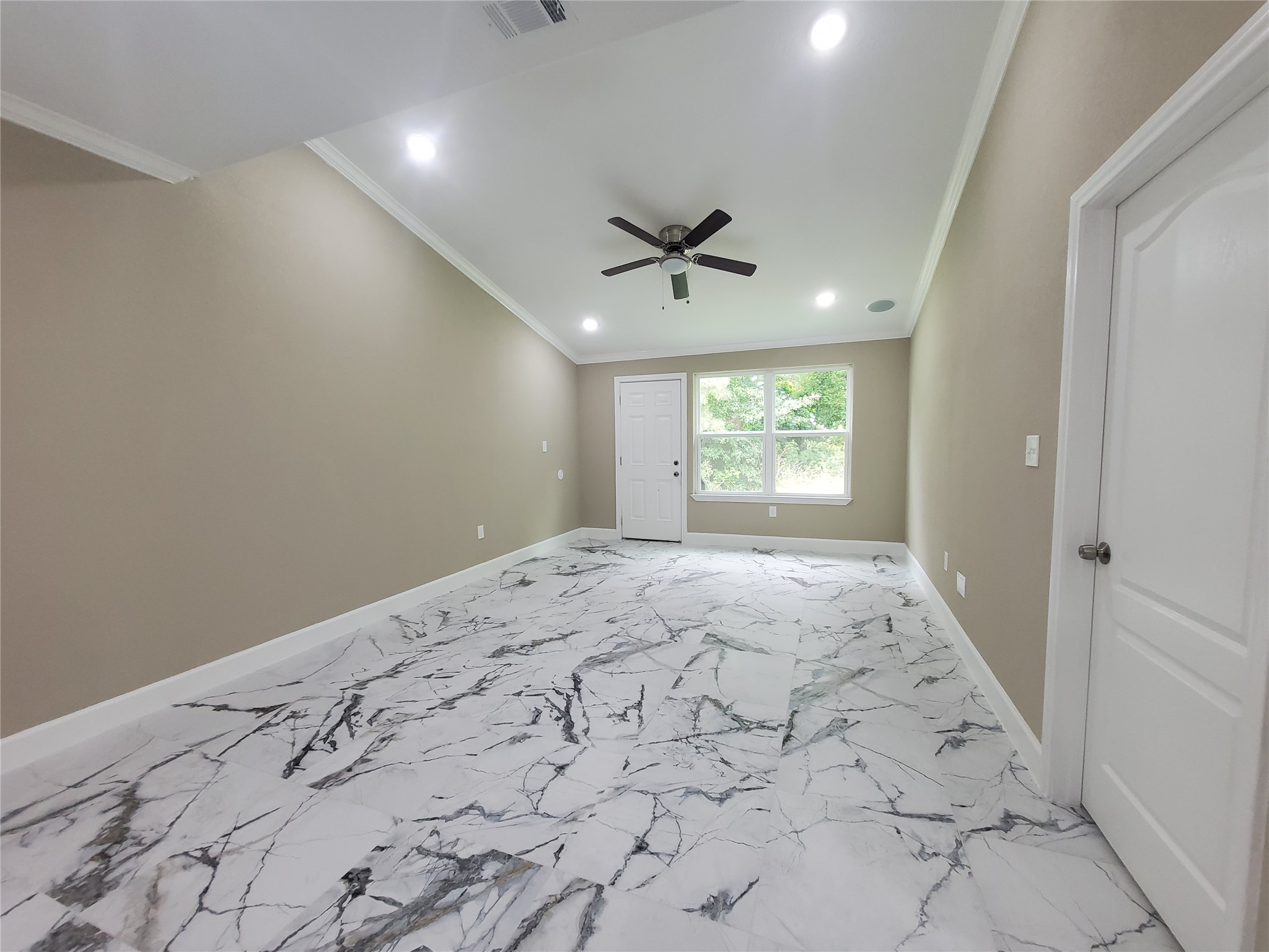 1306 North 9th Street Conroe, TX 77301 - Photo 29 of 47 a view of empty room with window and ceiling fan