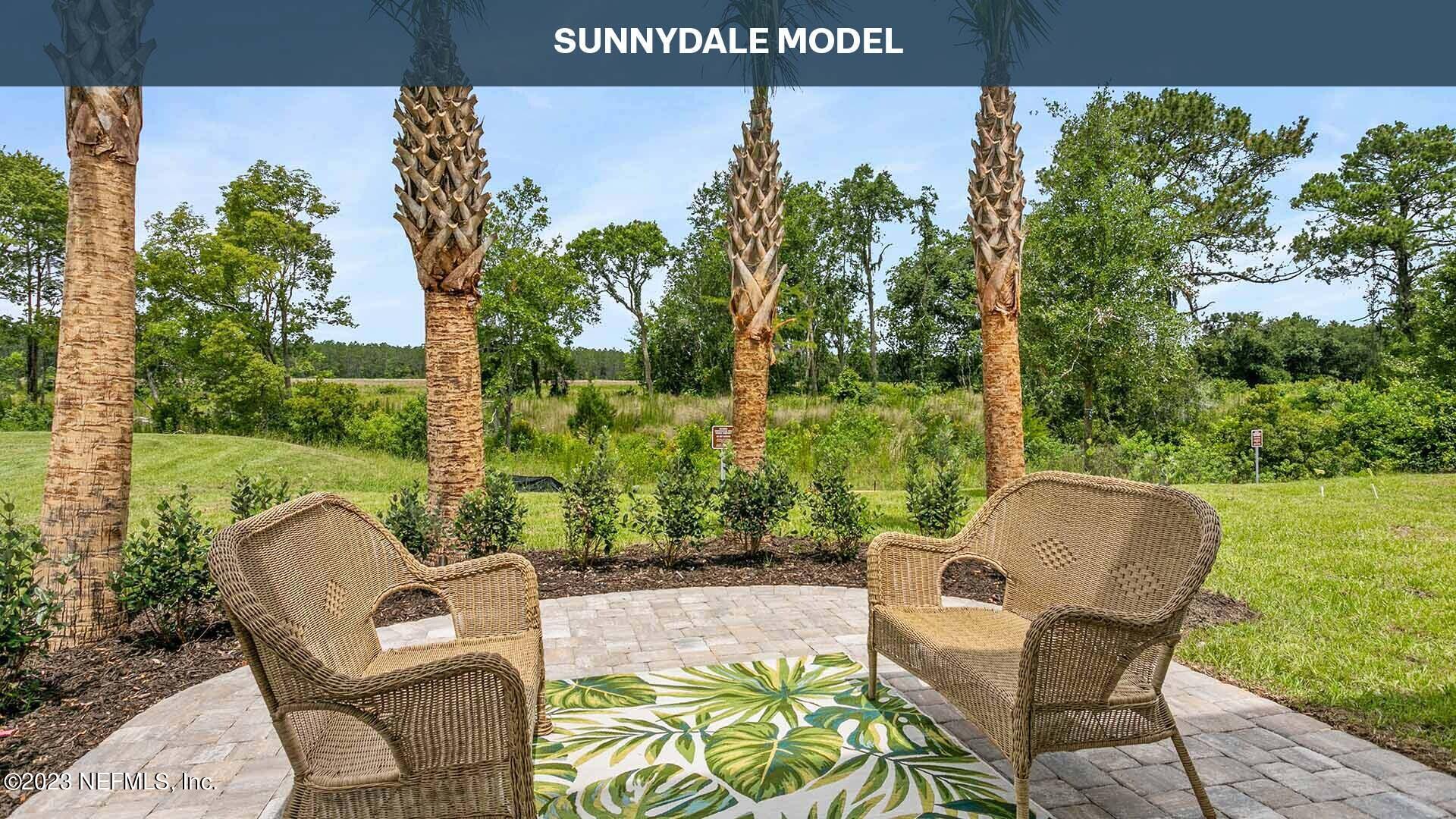 210 Albacete Rd Street St. Augustine, FL 32084 - Photo 19 of 32 an outdoor sitting area with couch and plants