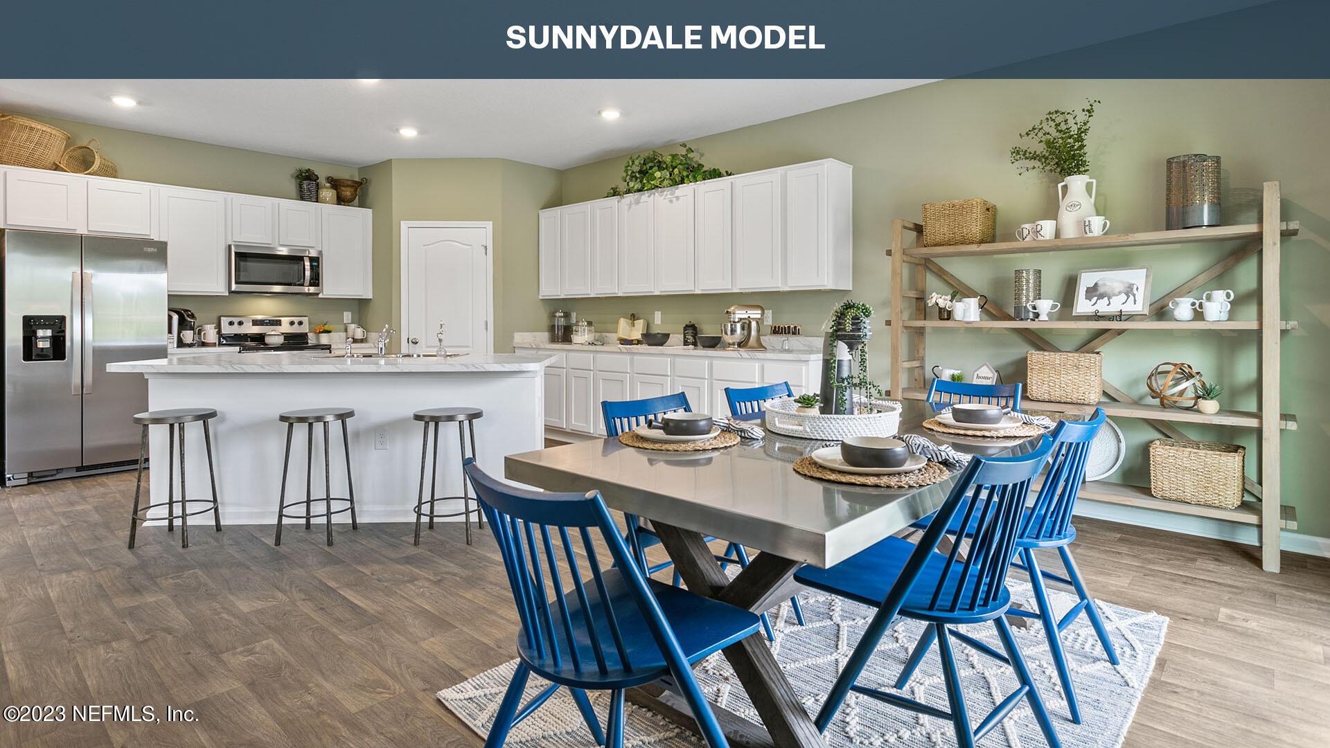 210 Albacete Rd Street St. Augustine, FL 32084 - Photo 8 of 32 a dining table with kitchen island and a wooden floor