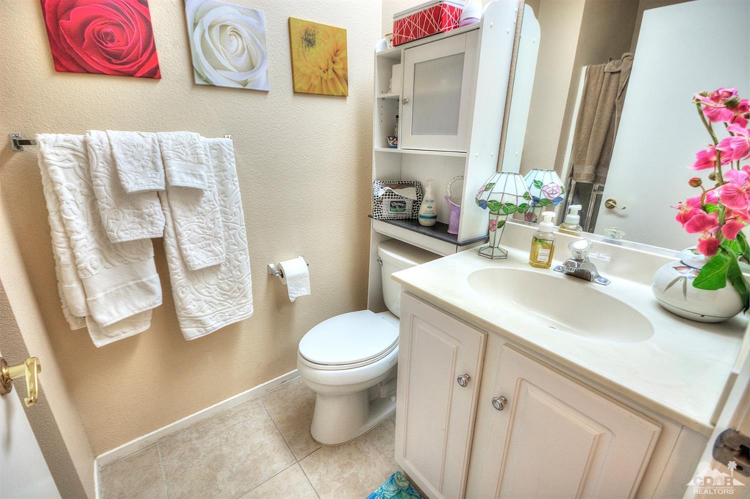 38590 Orangecrest Road Palm Desert, CA 92211 - Photo 16 of 23 a bathroom with a sink and toilet