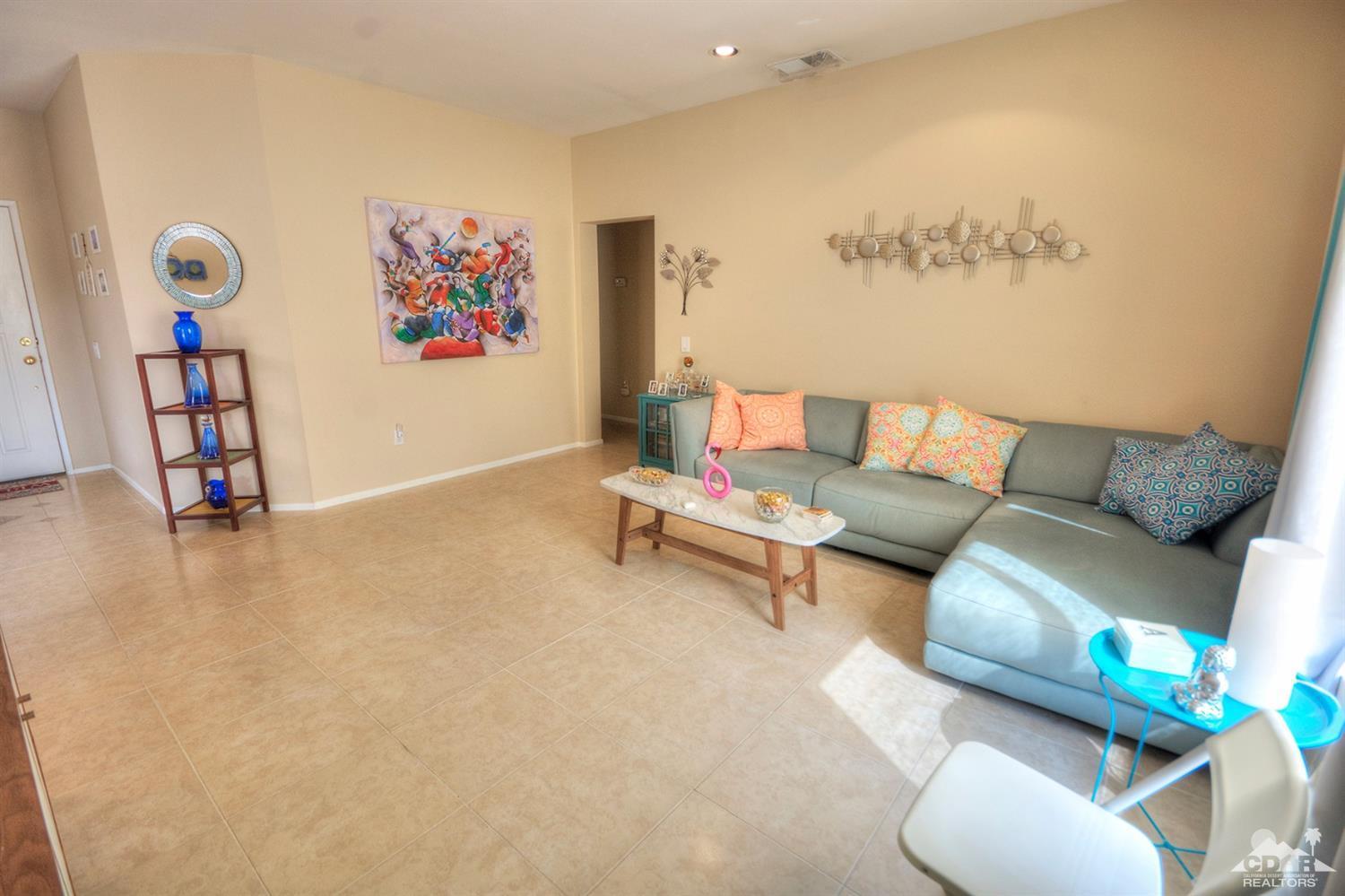 38590 Orangecrest Road Palm Desert, CA 92211 - Photo 6 of 23 a living room with furniture and a flat screen tv