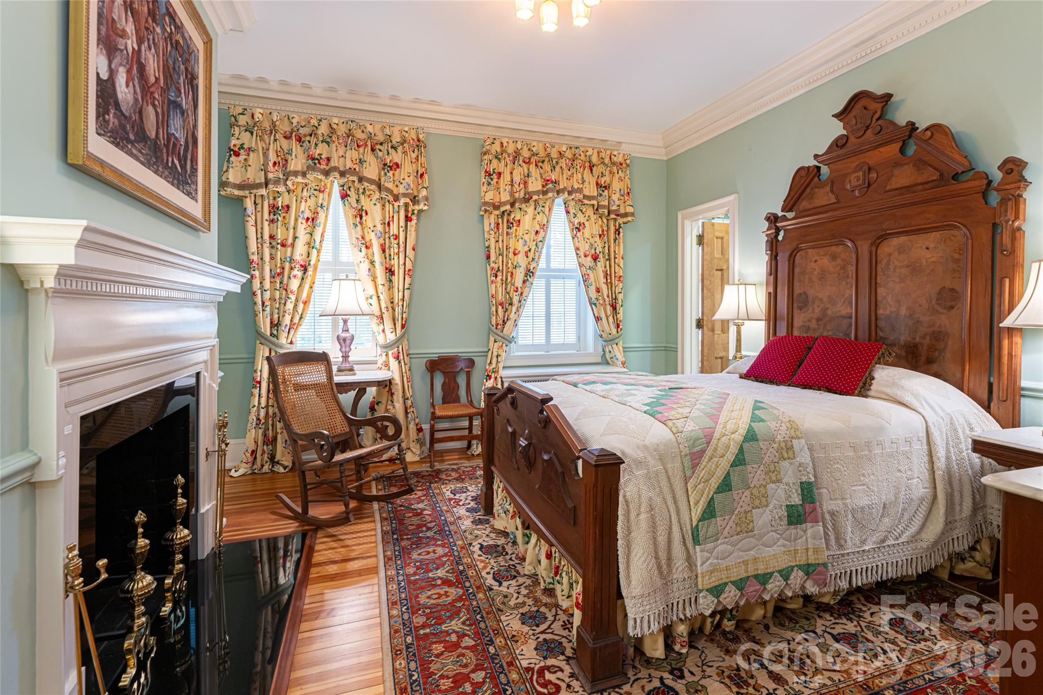 324 Vanderbilt Road Asheville, NC 28803 - Photo 22 of 48 a bed sitting in a bedroom next to a window