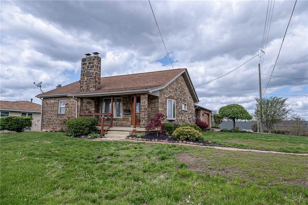 699 Kaye Avenue Monaca, PA 15061 - Photo 5 of 43 a front view of a house with garden