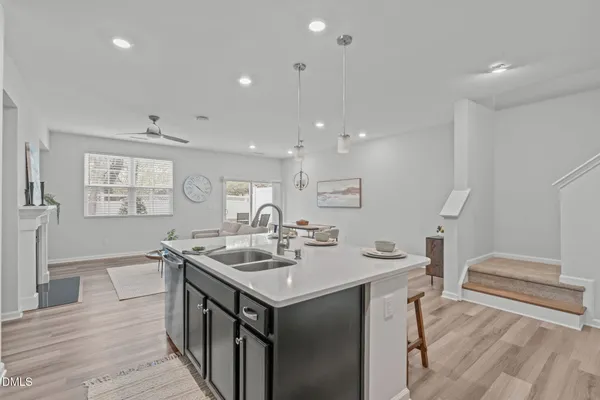 a living room with furniture a table and a fireplace