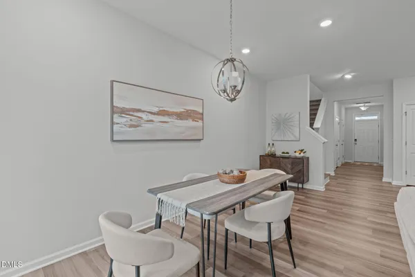 a dining room with furniture and window