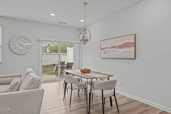 a living room with furniture a rug and a fireplace