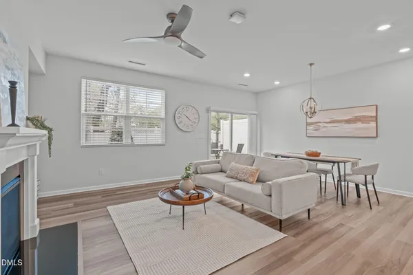 a view of hallway with closet and a ceiling fan
