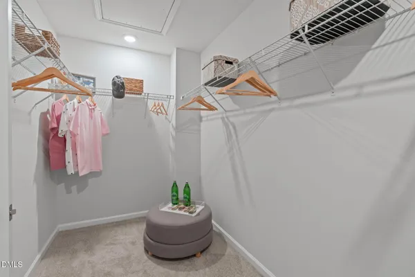 a view of a room that has a table and a chair