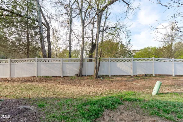 front view of a house with a yard and an outdoor space