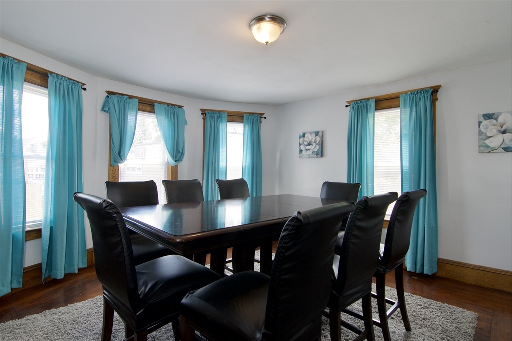 16 Amity Court Springfield, MA 01108 - Photo 11 of 42 a view of a dining room with furniture window and wooden floor