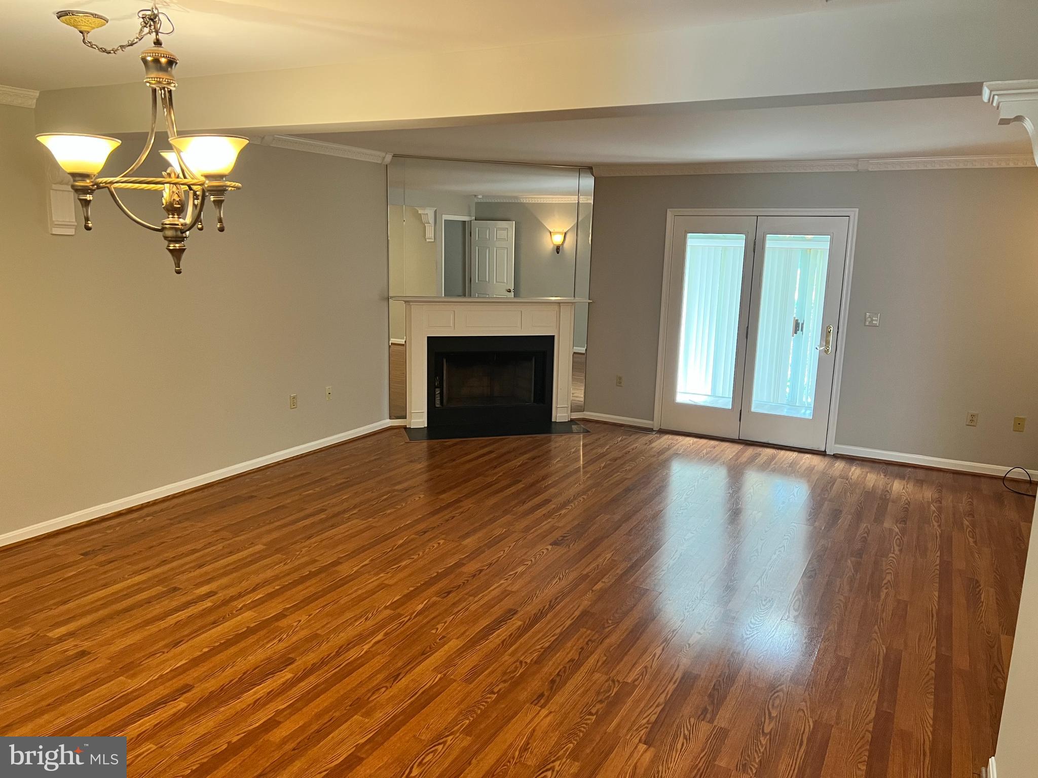 2053 Raleigh Road Hummelstown, PA 17036 - Photo 13 of 22 wooden floor fireplace and windows in an empty room