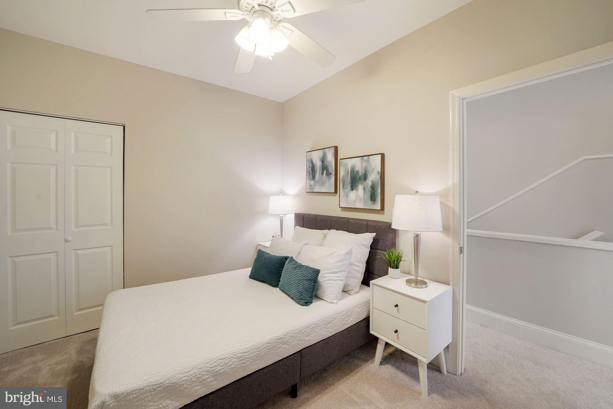 40 R Street Northwest Washington, DC 20001 - Photo 22 of 59 a bedroom with a bed and a chandelier