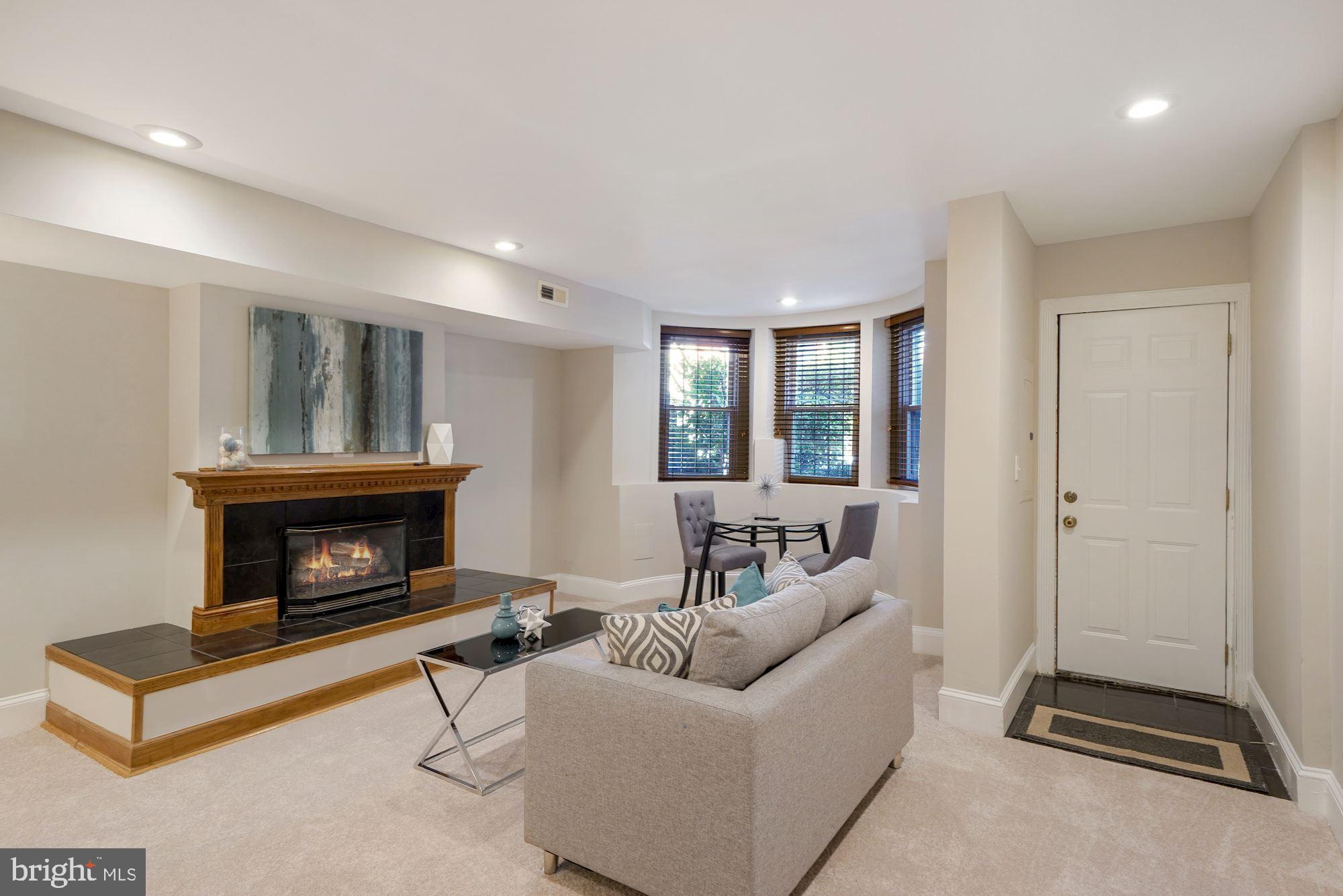 40 R Street Northwest Washington, DC 20001 - Photo 25 of 59 a living room with furniture and a fireplace