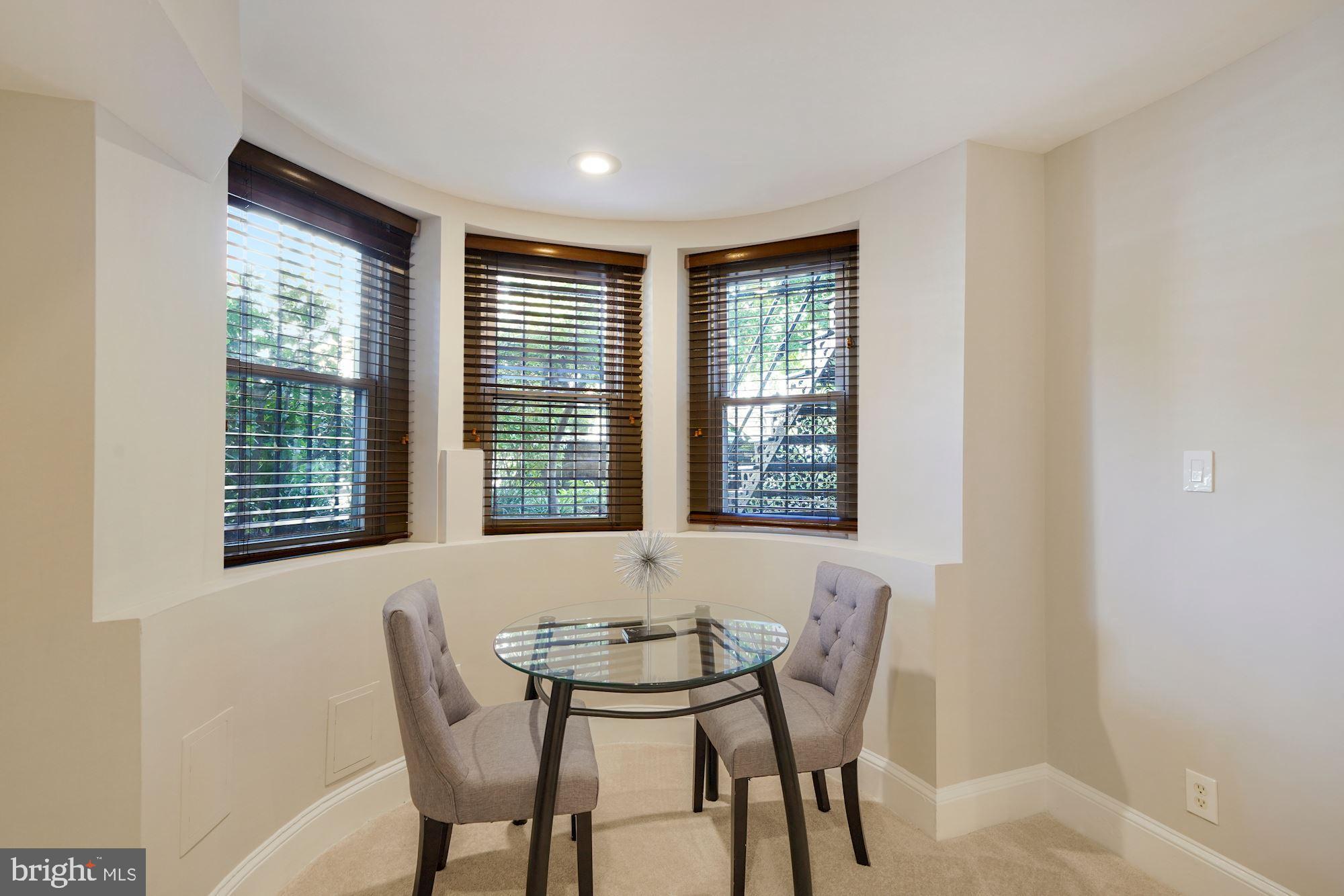 40 R Street Northwest Washington, DC 20001 - Photo 27 of 59 a view of a dining room with furniture and windows