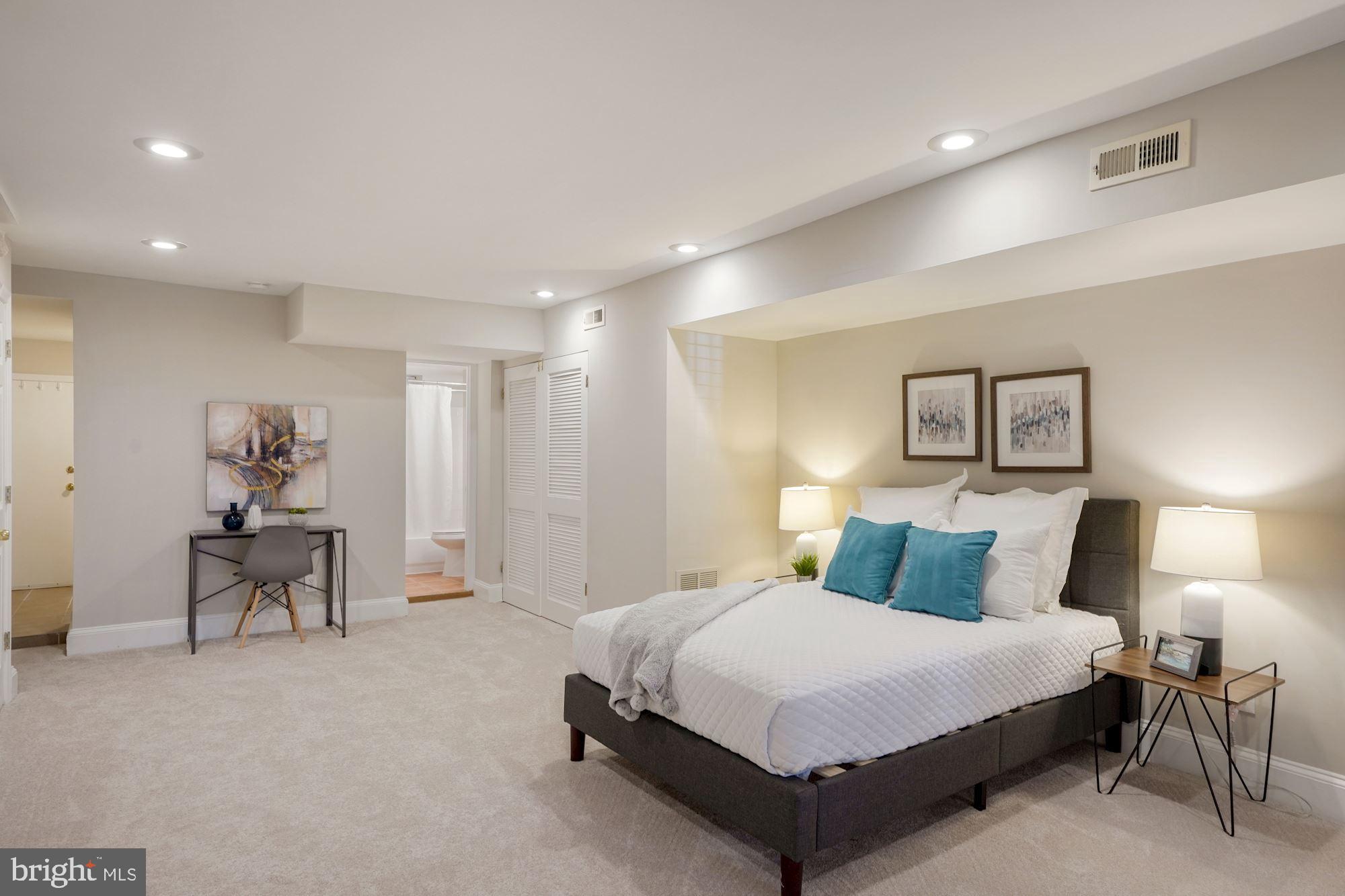 40 R Street Northwest Washington, DC 20001 - Photo 29 of 59 a bedroom with a bed and a table