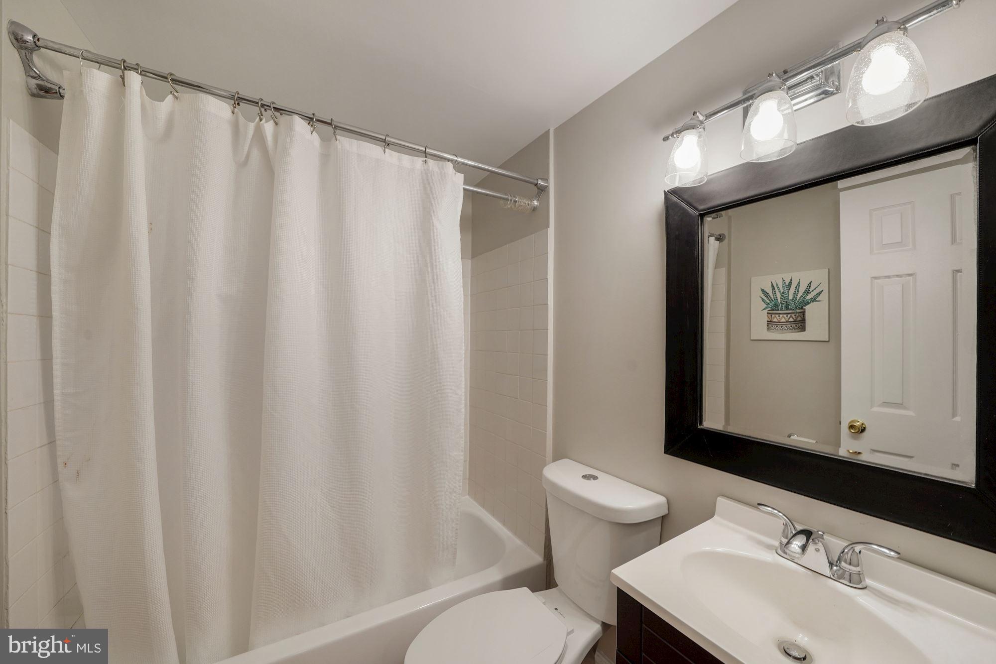 40 R Street Northwest Washington, DC 20001 - Photo 31 of 59 a bathroom with a sink and a mirror