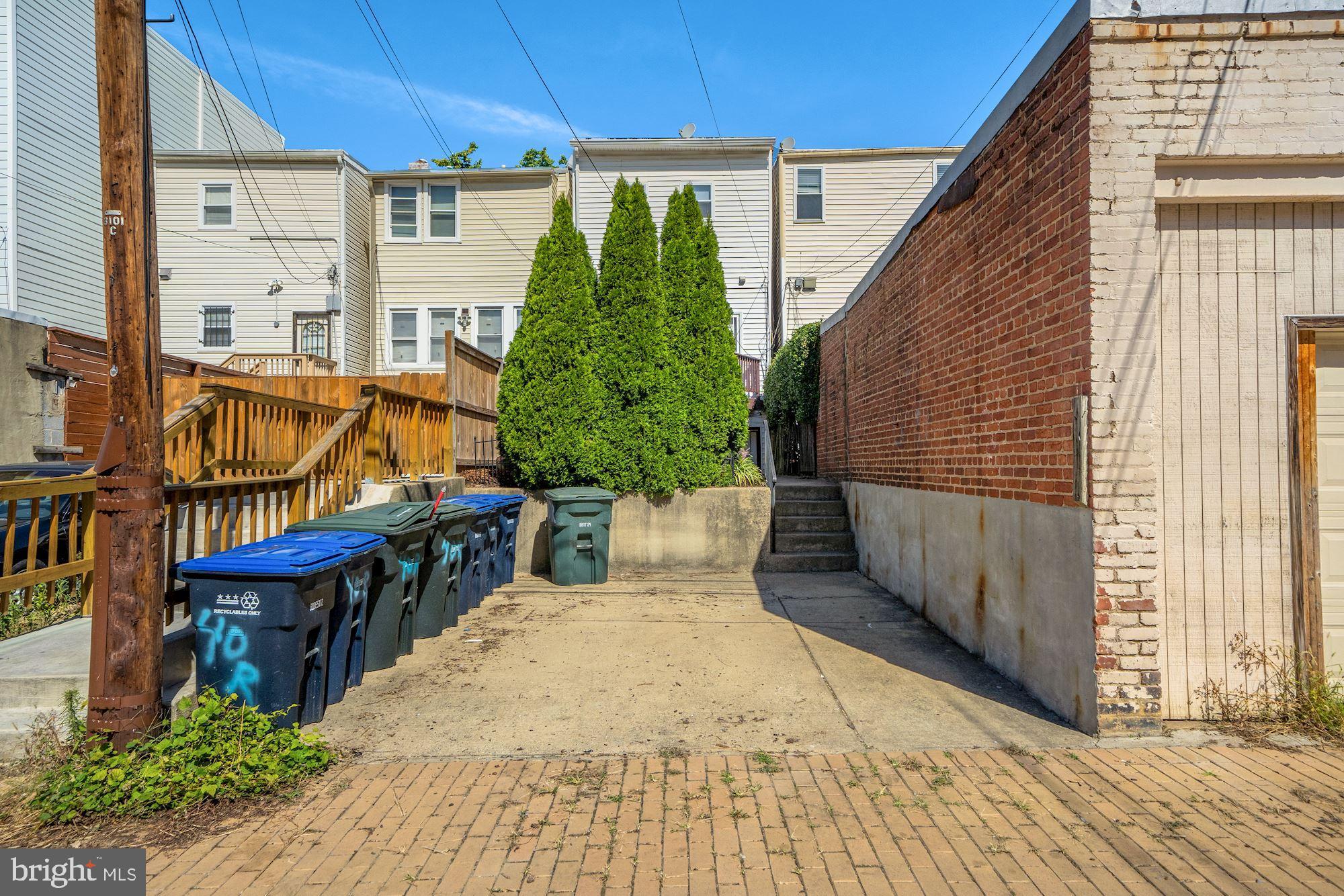 40 R Street Northwest Washington, DC 20001 - Photo 38 of 59 a view of a patio with table and chairs potted plants with wooden floor