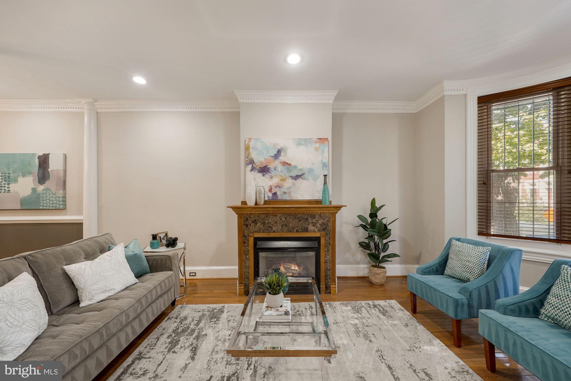 40 R Street Northwest Washington, DC 20001 - Photo 5 of 59 a living room with furniture a fireplace and a large window