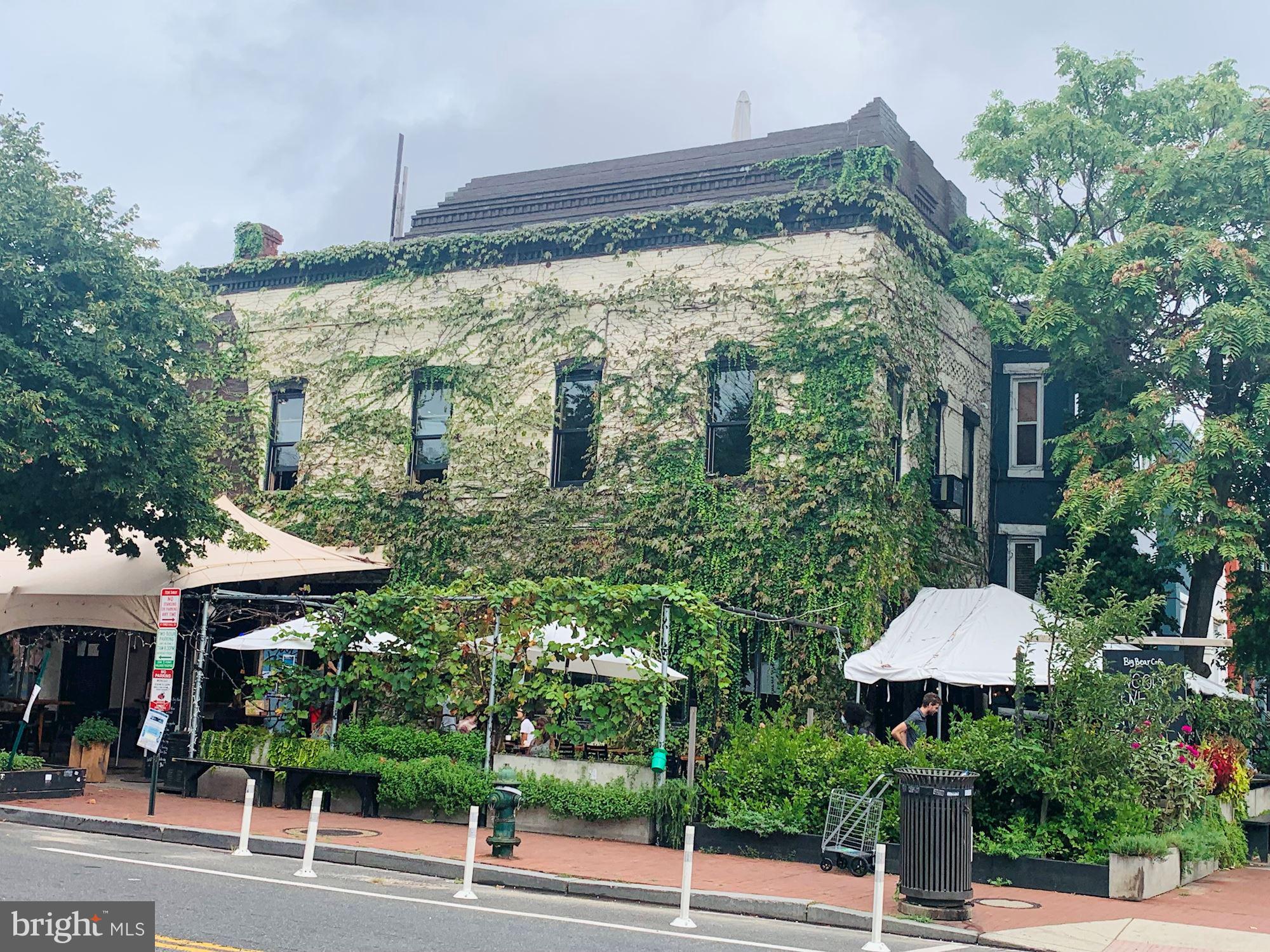 40 R Street Northwest Washington, DC 20001 - Photo 48 of 59 a street sign on a tree in front of building