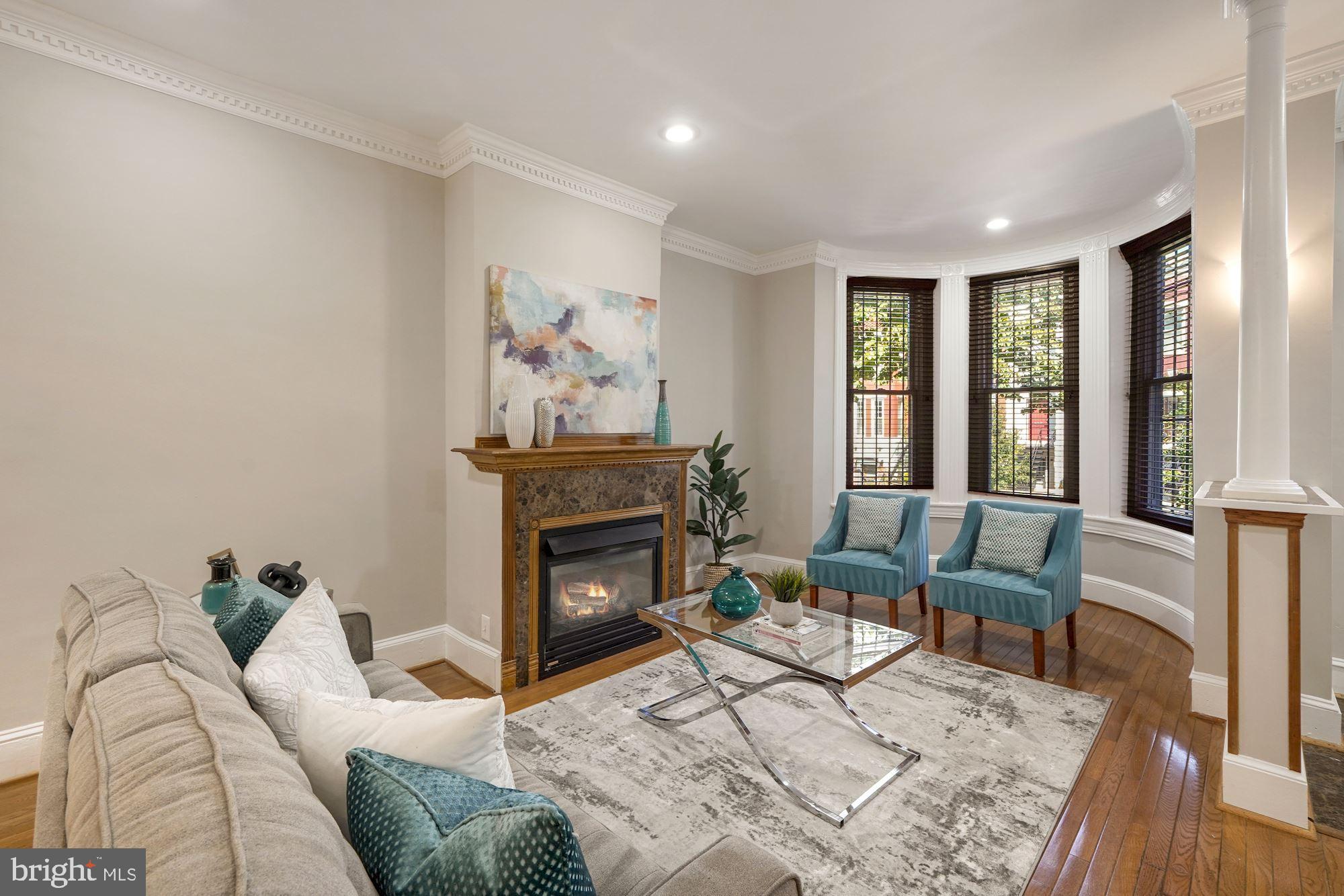 40 R Street Northwest Washington, DC 20001 - Photo 6 of 59 a living room with furniture and a fireplace