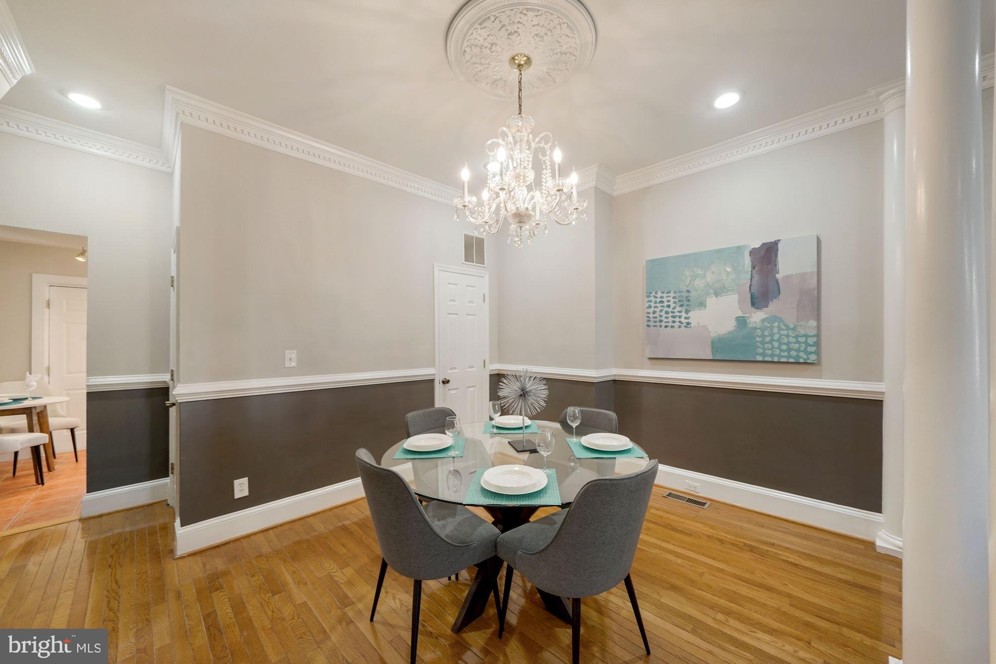 40 R Street Northwest Washington, DC 20001 - Photo 7 of 59 a view of a dining room with furniture and wooden floor