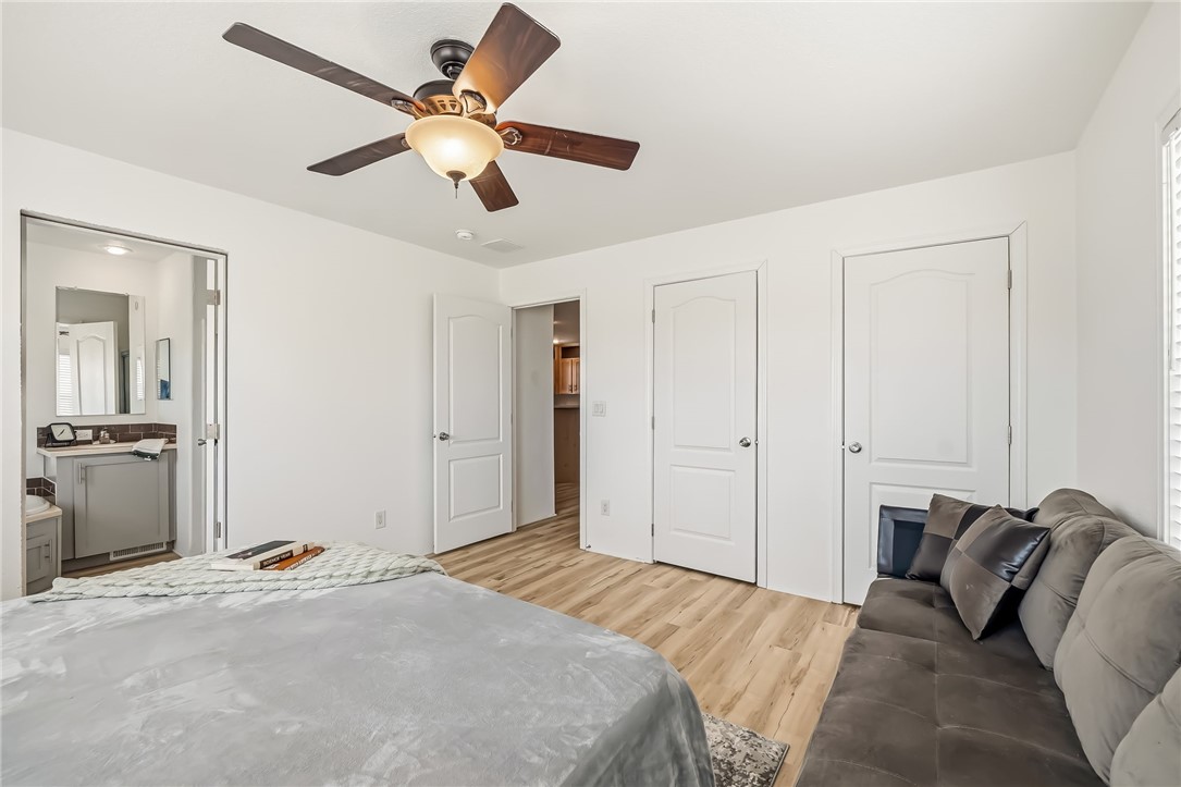 1286 Dike Road Mohave Valley, AZ 86440 - Photo 26 of 35 a bed room with a bed and a ceiling fan