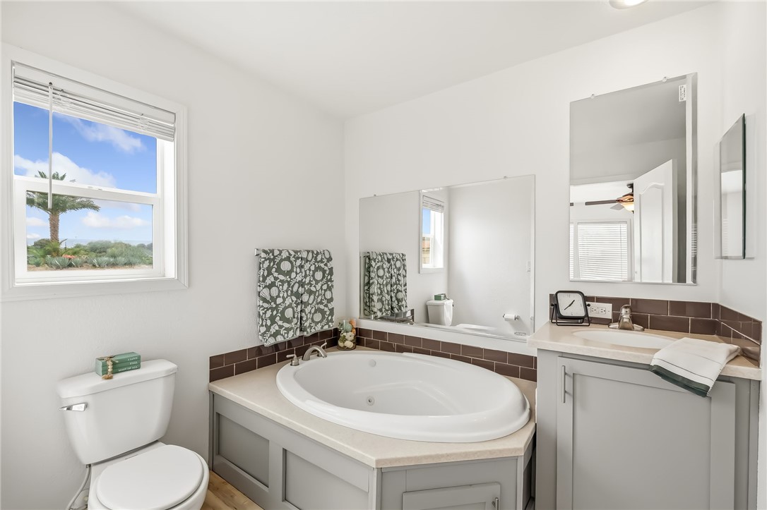 1286 Dike Road Mohave Valley, AZ 86440 - Photo 27 of 35 a bathroom with a sink and a toilet