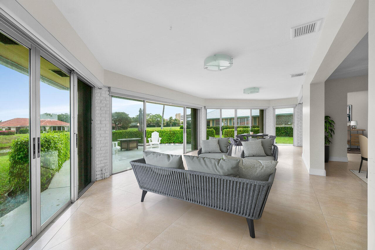 362 Yorktowne Circle Atlantis, FL 33462 - Photo 11 of 41 a living room with furniture and a large window