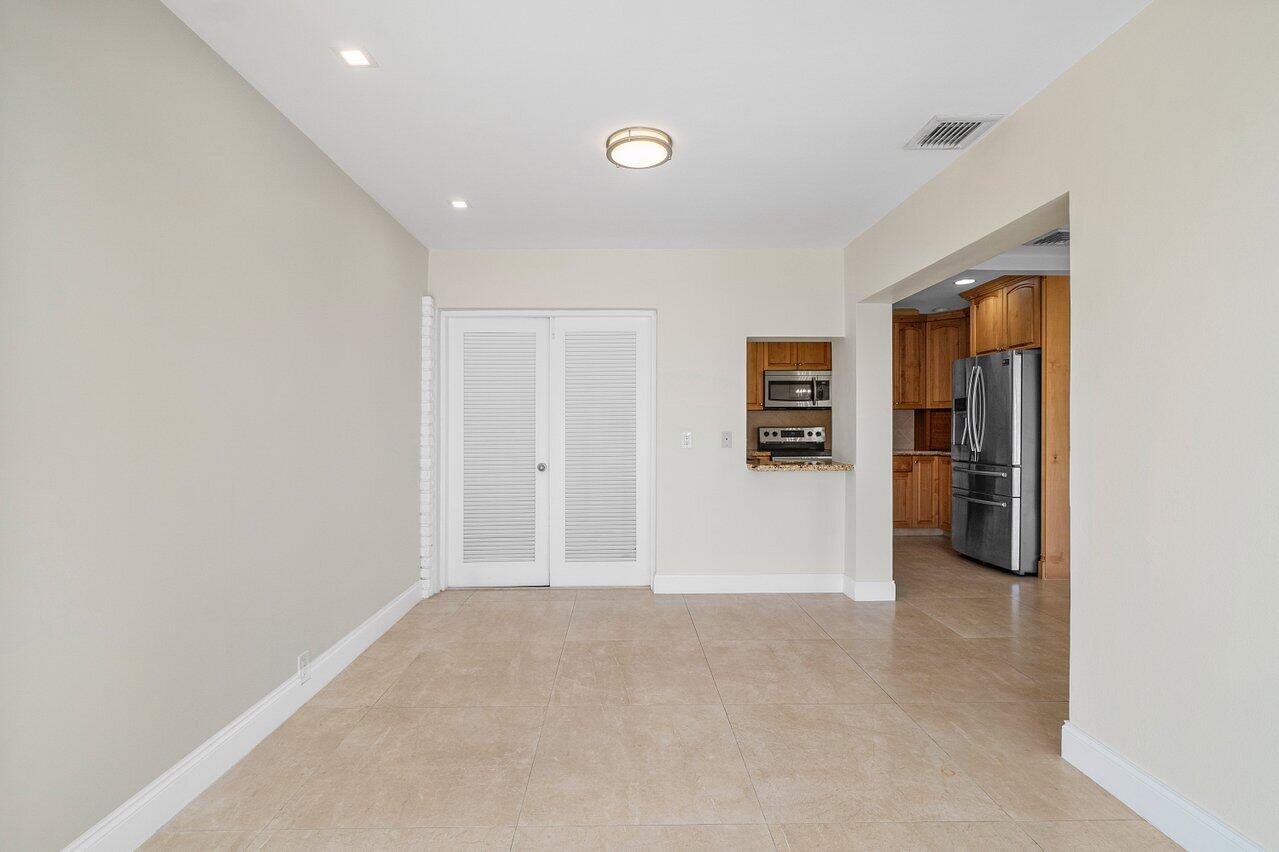 362 Yorktowne Circle Atlantis, FL 33462 - Photo 14 of 41 a view of a livingroom with a staircase