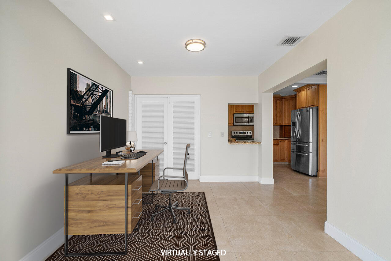 362 Yorktowne Circle Atlantis, FL 33462 - Photo 15 of 41 a living room with furniture and a flat screen tv