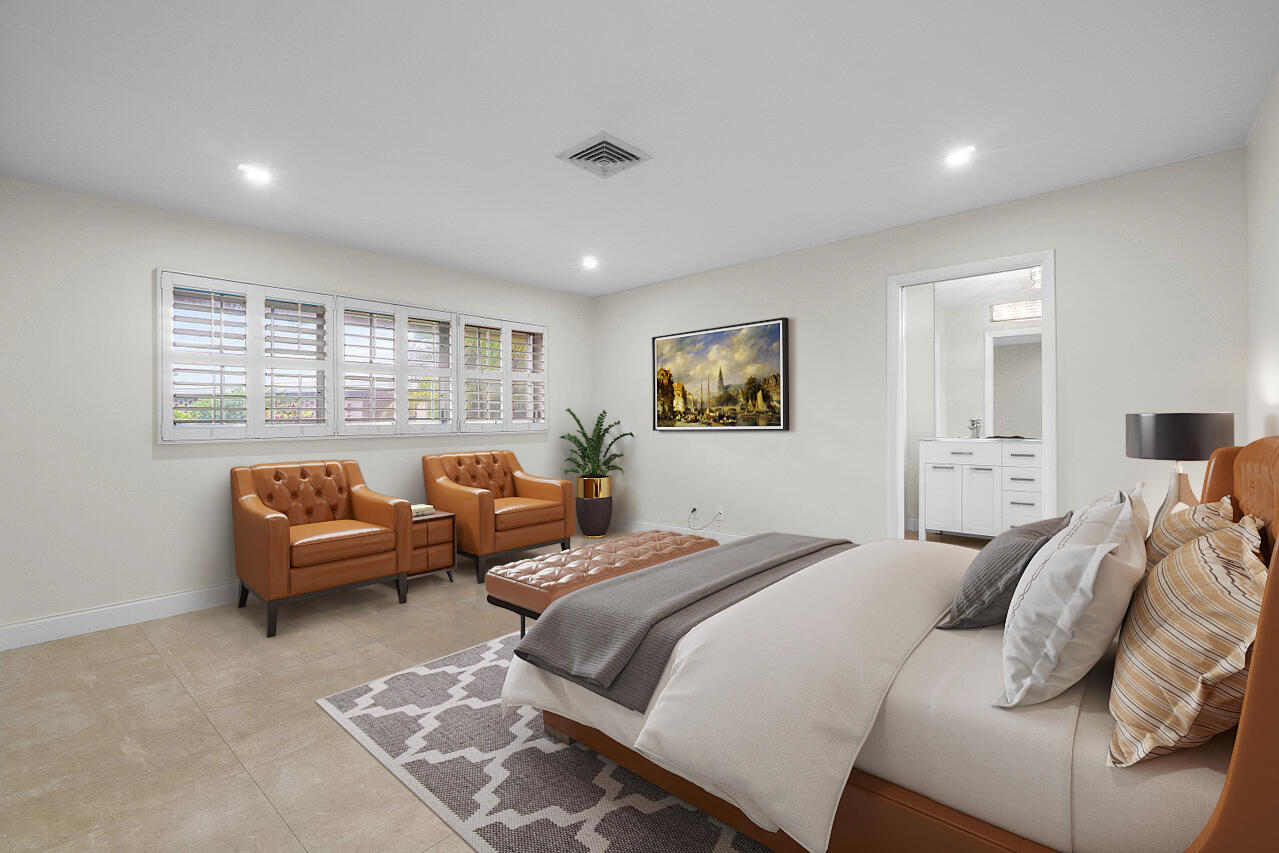 362 Yorktowne Circle Atlantis, FL 33462 - Photo 17 of 41 a bedroom with a bed and a couch