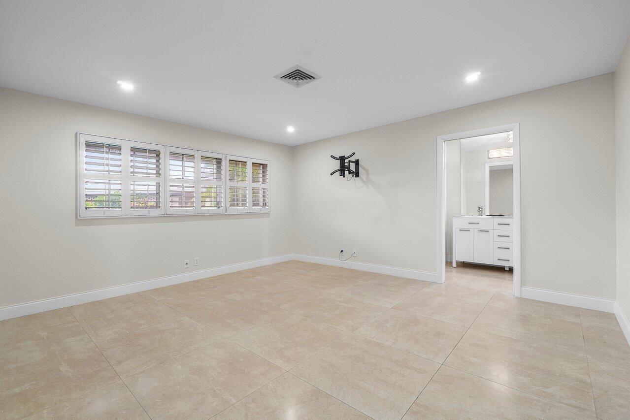 362 Yorktowne Circle Atlantis, FL 33462 - Photo 18 of 41 a view of an empty room with a window