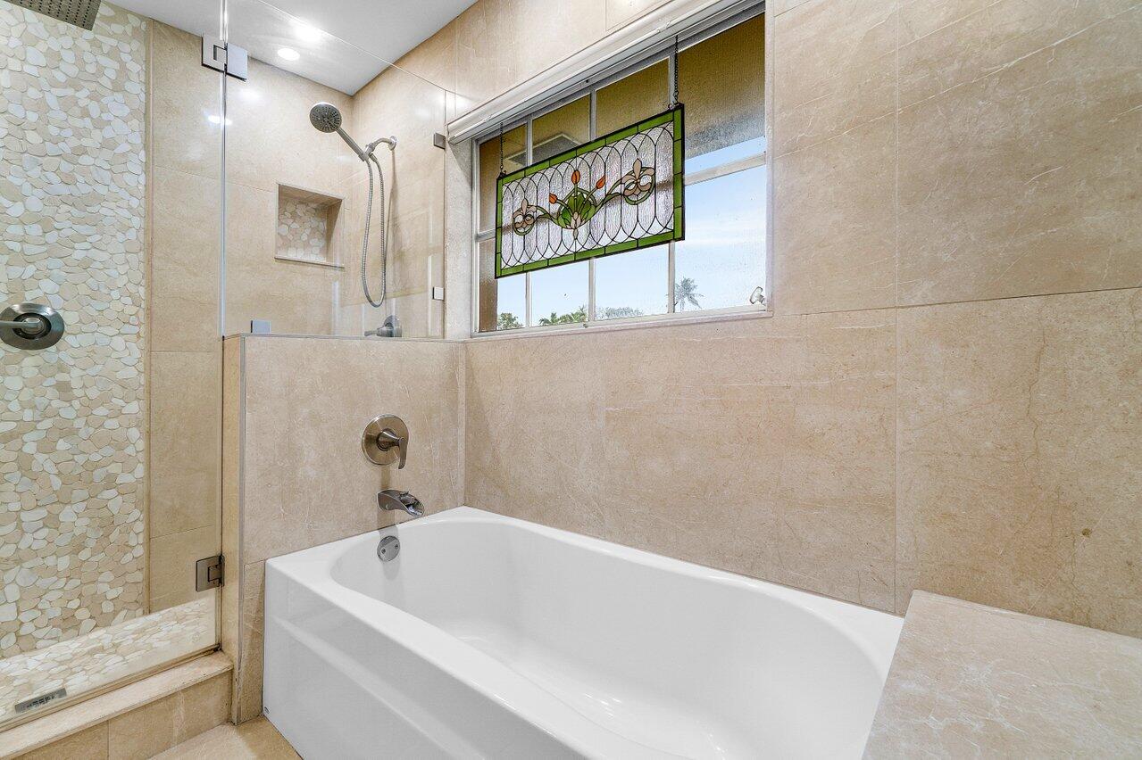 362 Yorktowne Circle Atlantis, FL 33462 - Photo 20 of 41 a white bath tub sitting next to a window